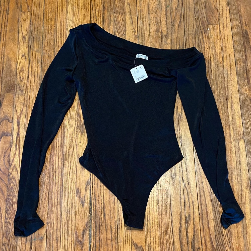 Free people black thong drop shoulder bodysuit. New with tags. Ladies small.